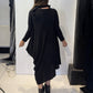 Back view of the Strelizia black dress showing its uneven hem