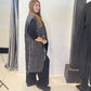 Side view of the Tulip waistcoat showing its side pocket and long striped silhouette