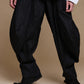 Black crinkle balloon trousers, front view with a wider stance