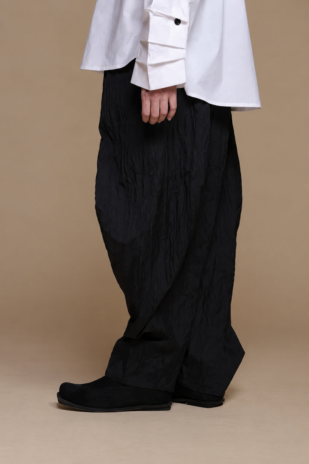 Black crinkle balloon trousers, left side view
