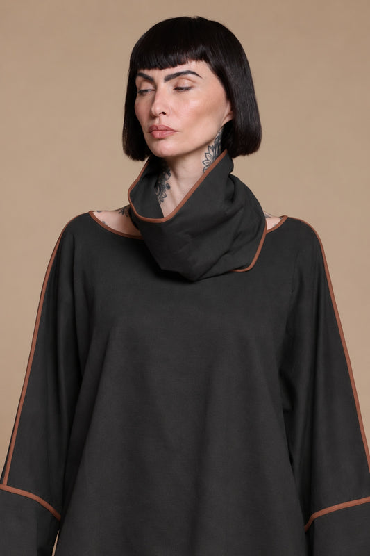 Black draped cotton top, close-up of the neckline and contrast edging