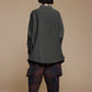Black cotton pocket shirt, back view showing the curved hem