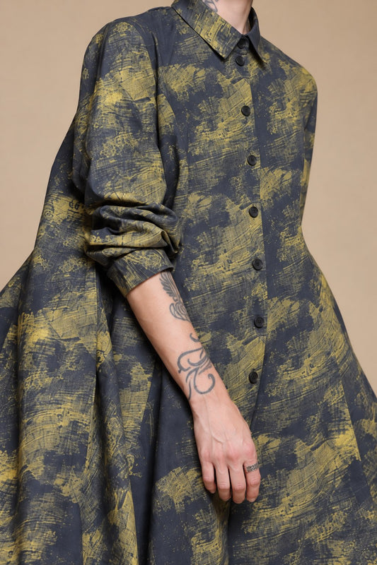 Yellow-olive and charcoal linen shirt, close-up of collar, buttons and rolled sleeve