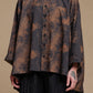 Printed cotton shirt, close-up of collar, buttons and uneven hem