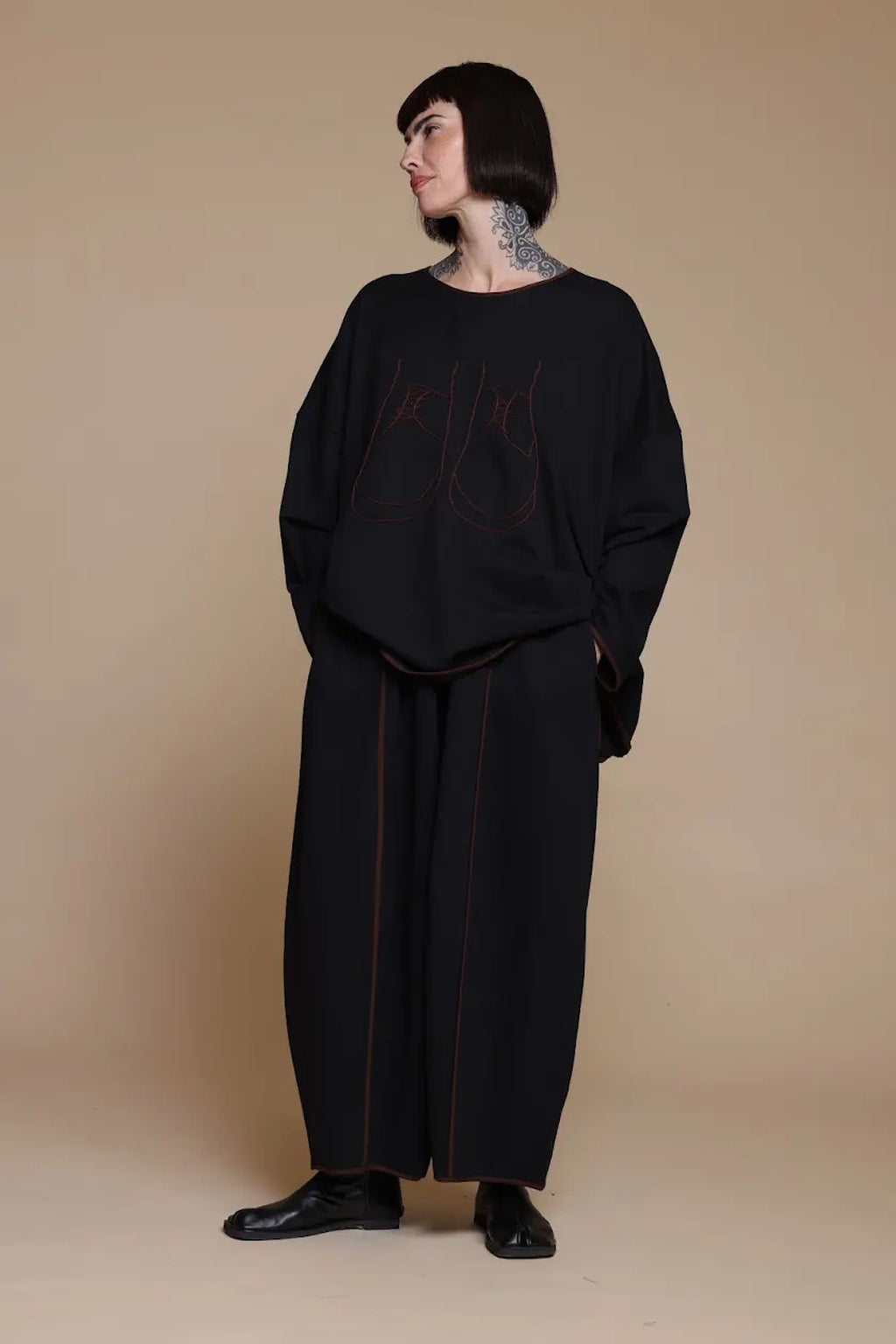 Black Kedem Sasson top with shoe artwork and contrast edging, front view