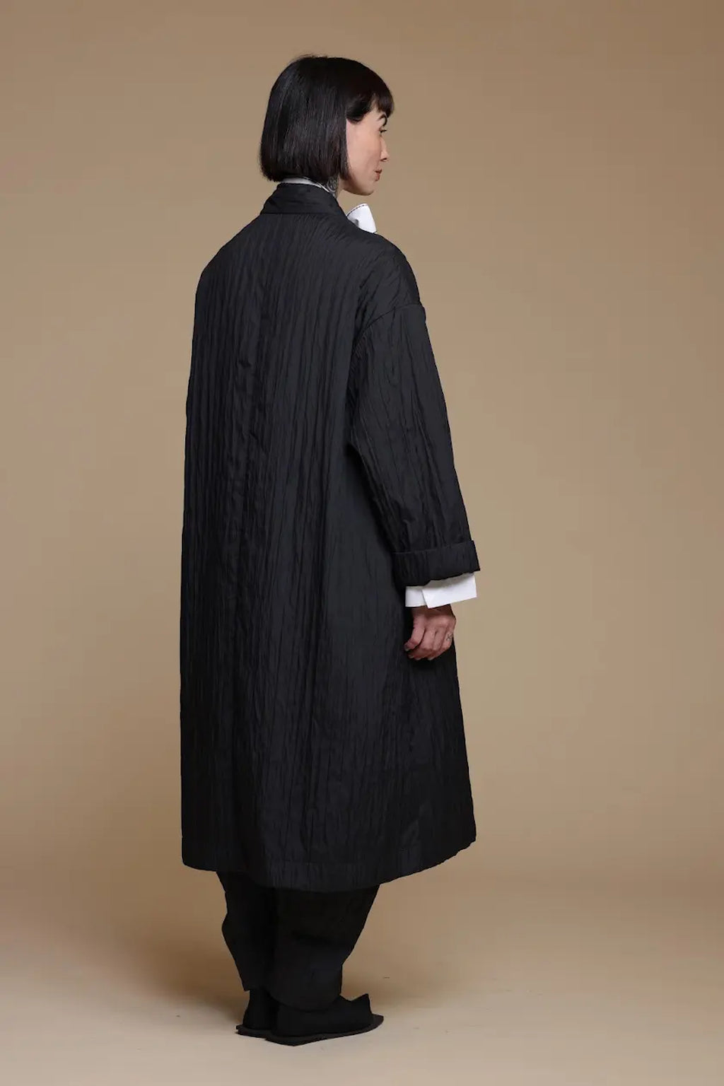 Black crinkle jacket, rear three-quarter view