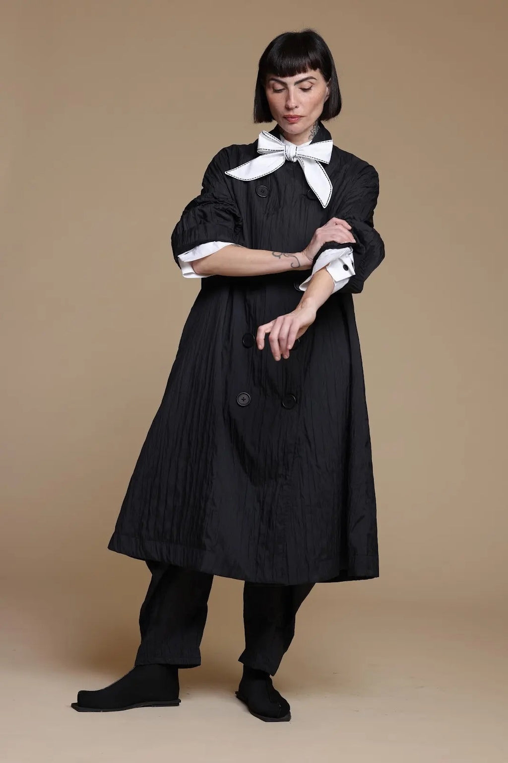 Black crinkle jacket, styling pose with the sleeves pushed up