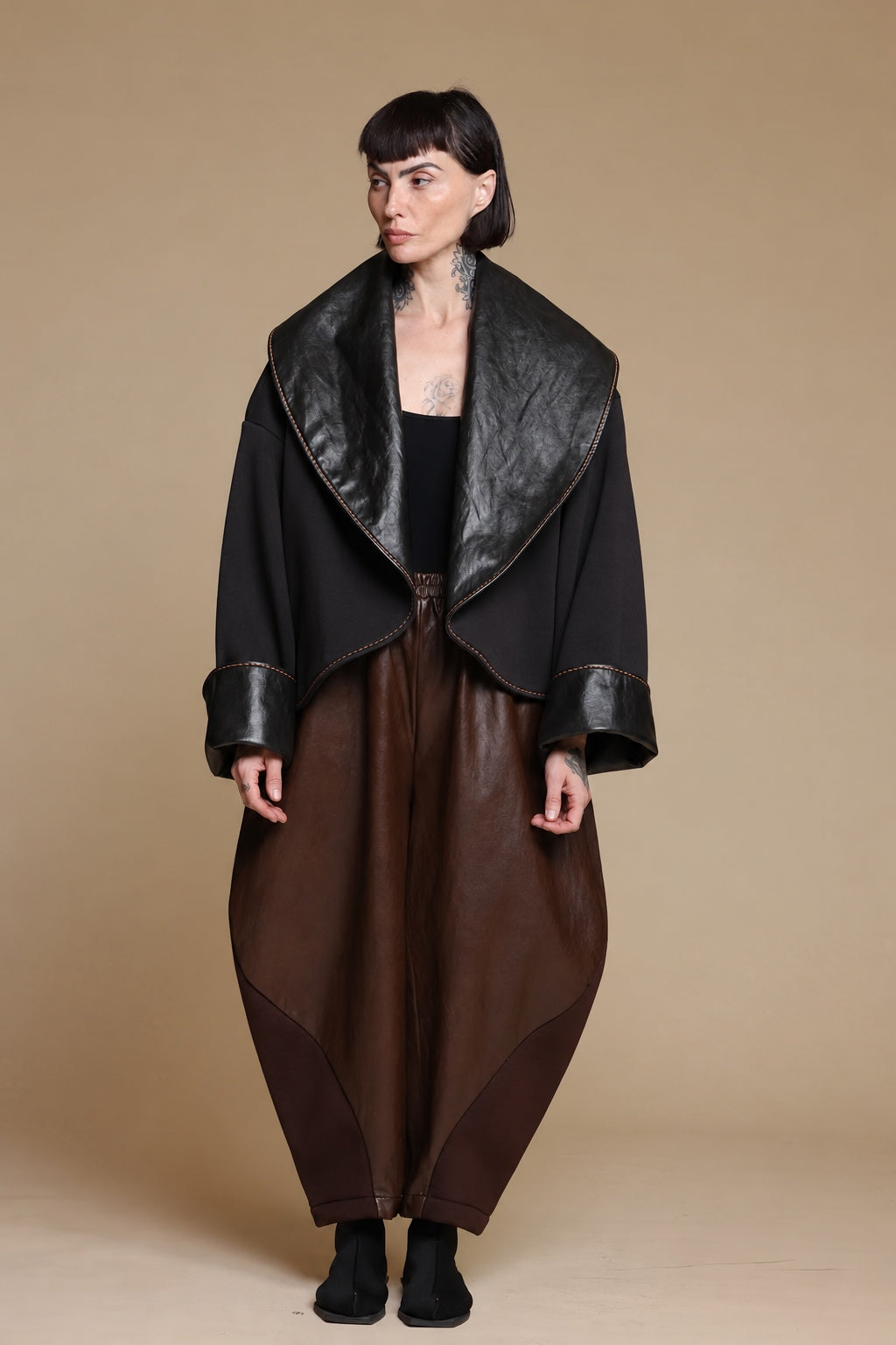 Black Kedem Sasson jacket with oversized glossy lapels, front view