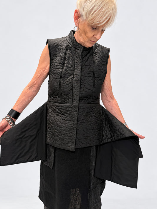 Kedziorek 5511 black asymmetric quilted gilet — shape shown view