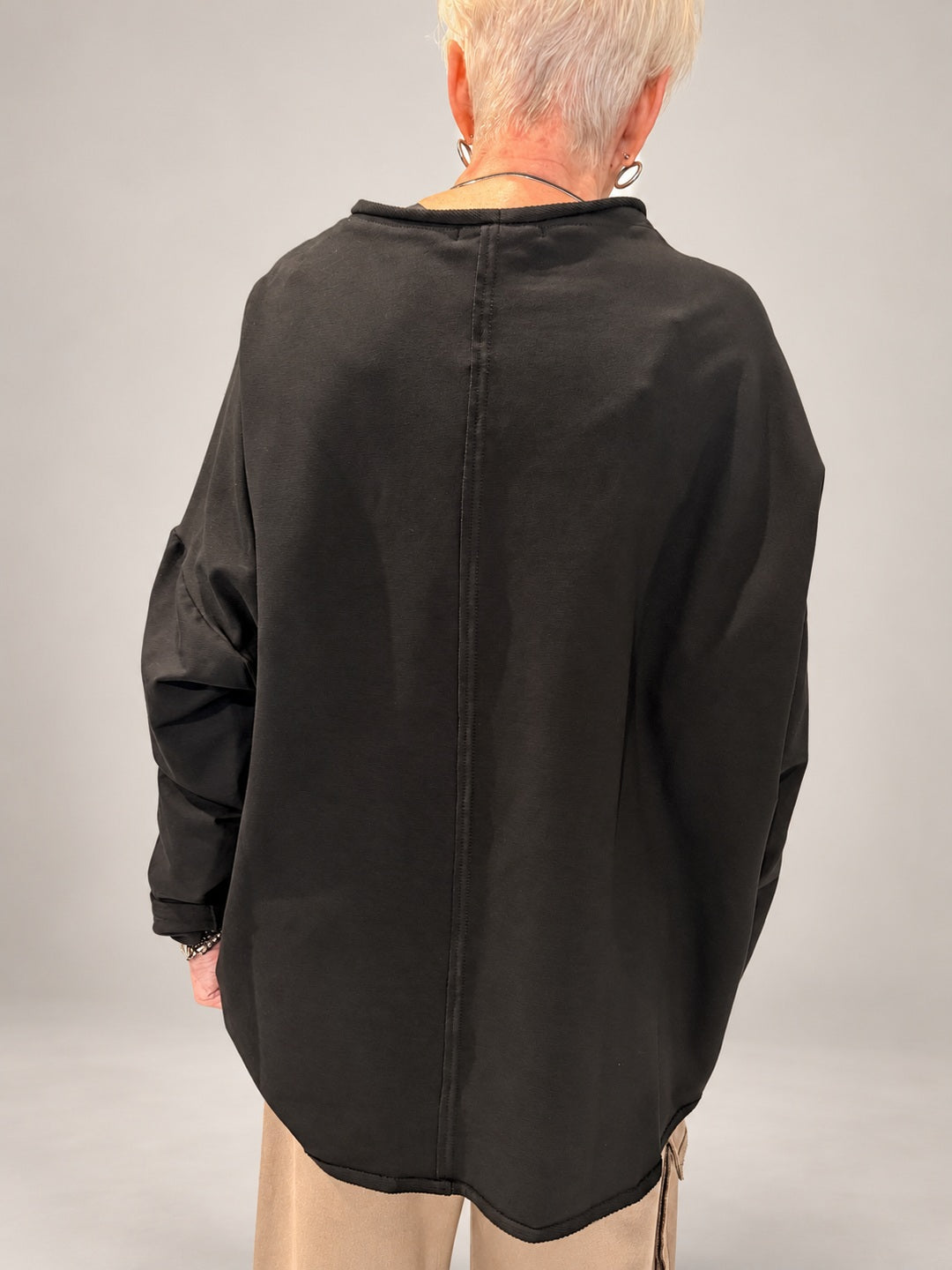 Kedziorek black floral print top, plain back with exposed centre seam and curved hem