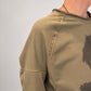 Kedziorek taupe floral print top, close-up of rolled neckline and exposed shoulder seam