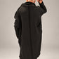 Kedziorek black cotton dress, back view showing raised collar and exposed centre seam