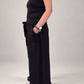 Kedziorek black wide-leg cotton trousers, side view showing cropped length and pocket