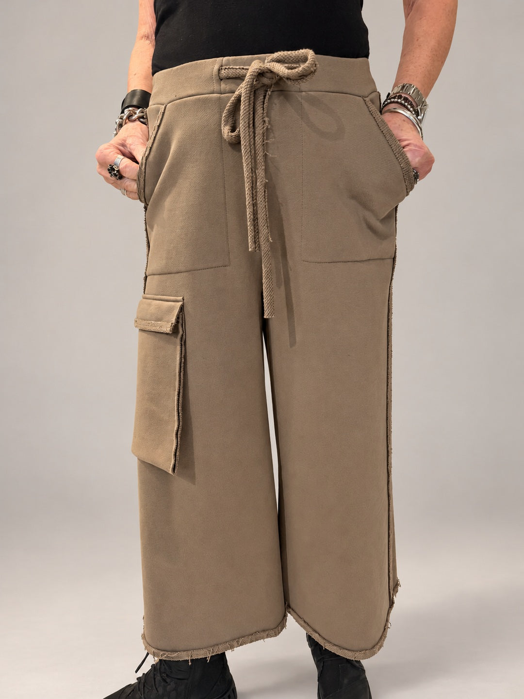 Kedziorek taupe wide-leg cotton trousers with drawstring waist and oversized cargo pocket, front view
