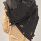 Kedziorek black cotton-blend scarf, close-up of leaf-shaped cut-outs and pointed edge across the back