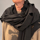Kedziorek black cotton-blend scarf, close-up of folded neckline drape and leaf-shaped cut-outs