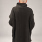 Kedziorek black textured merino wool top, back view showing longer hem and exposed centre seam