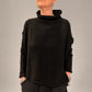 Kedziorek black textured merino wool top with raised neckline and dropped shoulders, front view