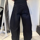 PLU Bubble denim trousers in dark blue, back view