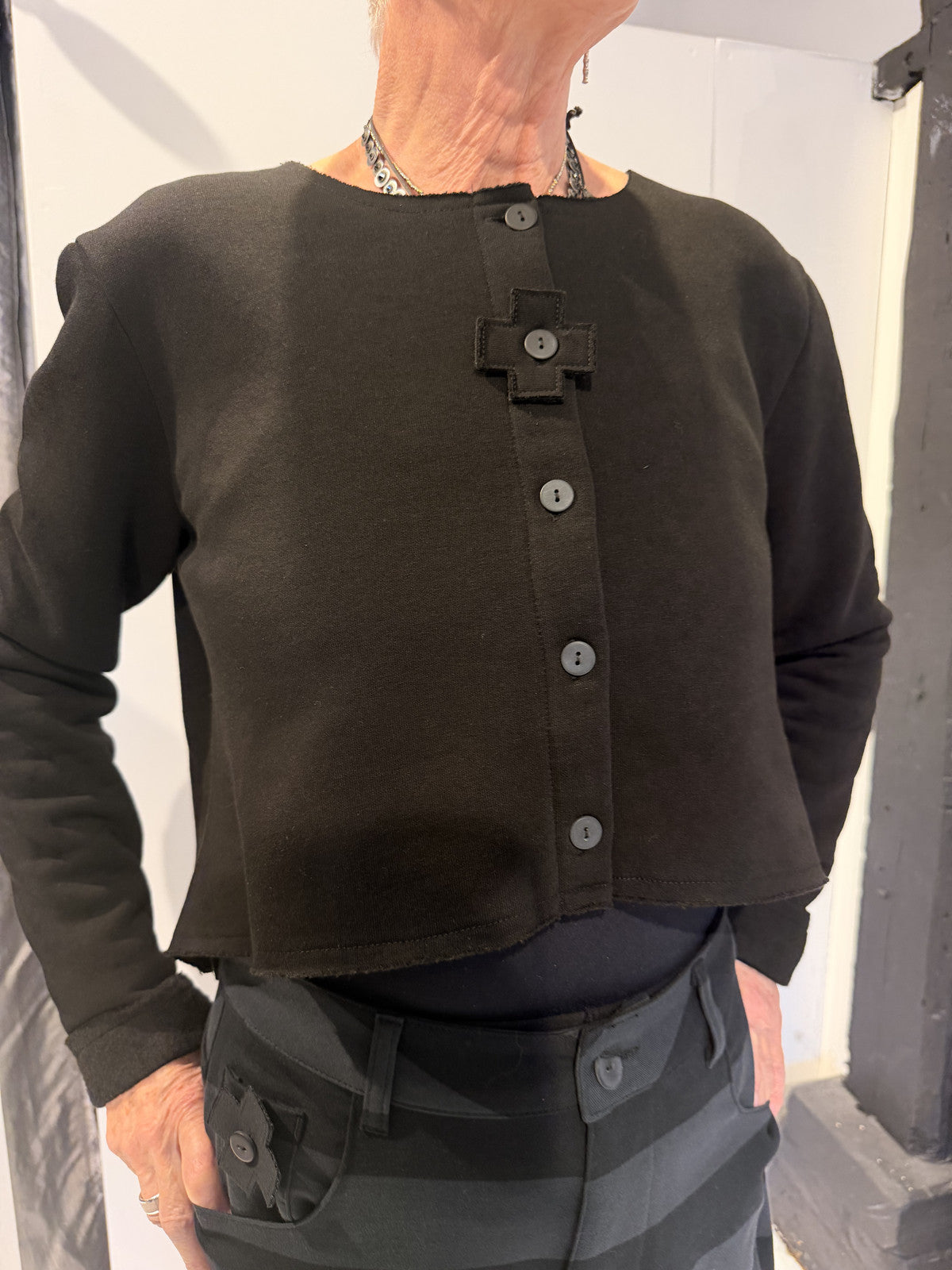 PLU Neocrop cardigan in black, front view