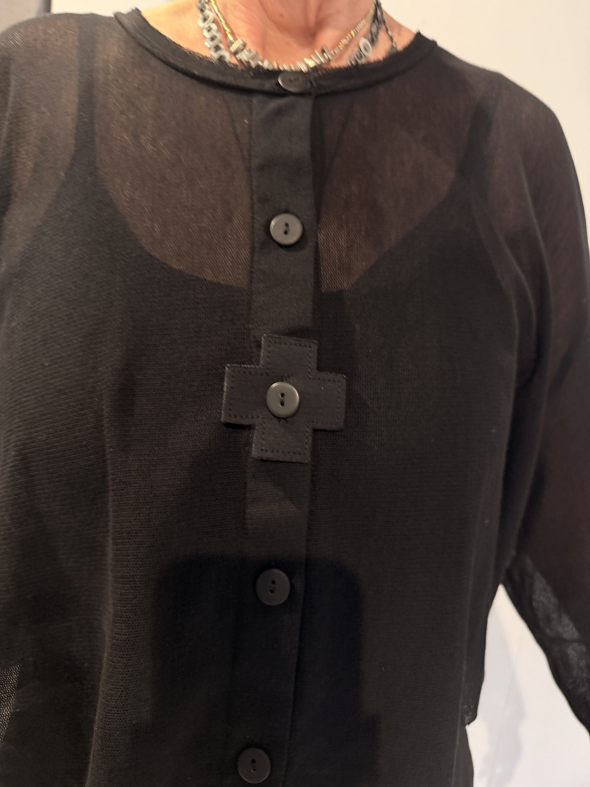 PLU Snuggle mesh cardigan in black, button and mesh detail