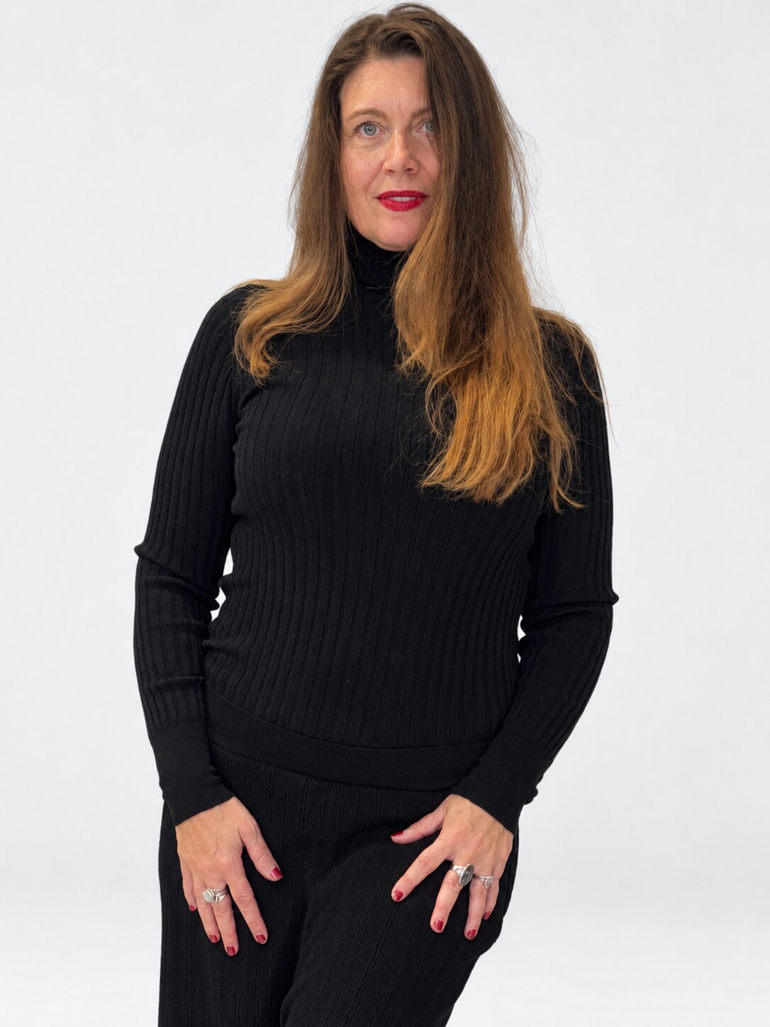 Transit black ribbed virgin-wool roll-neck top – three-quarter front view