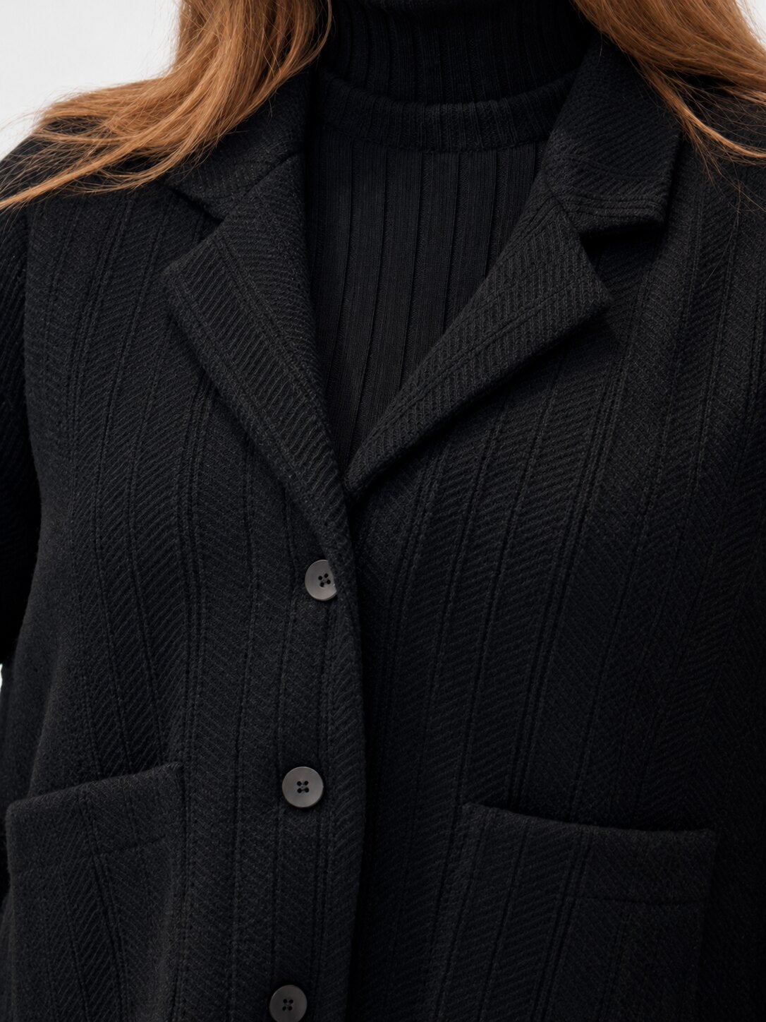 Transit black virgin-wool jacket – lapel and button detail