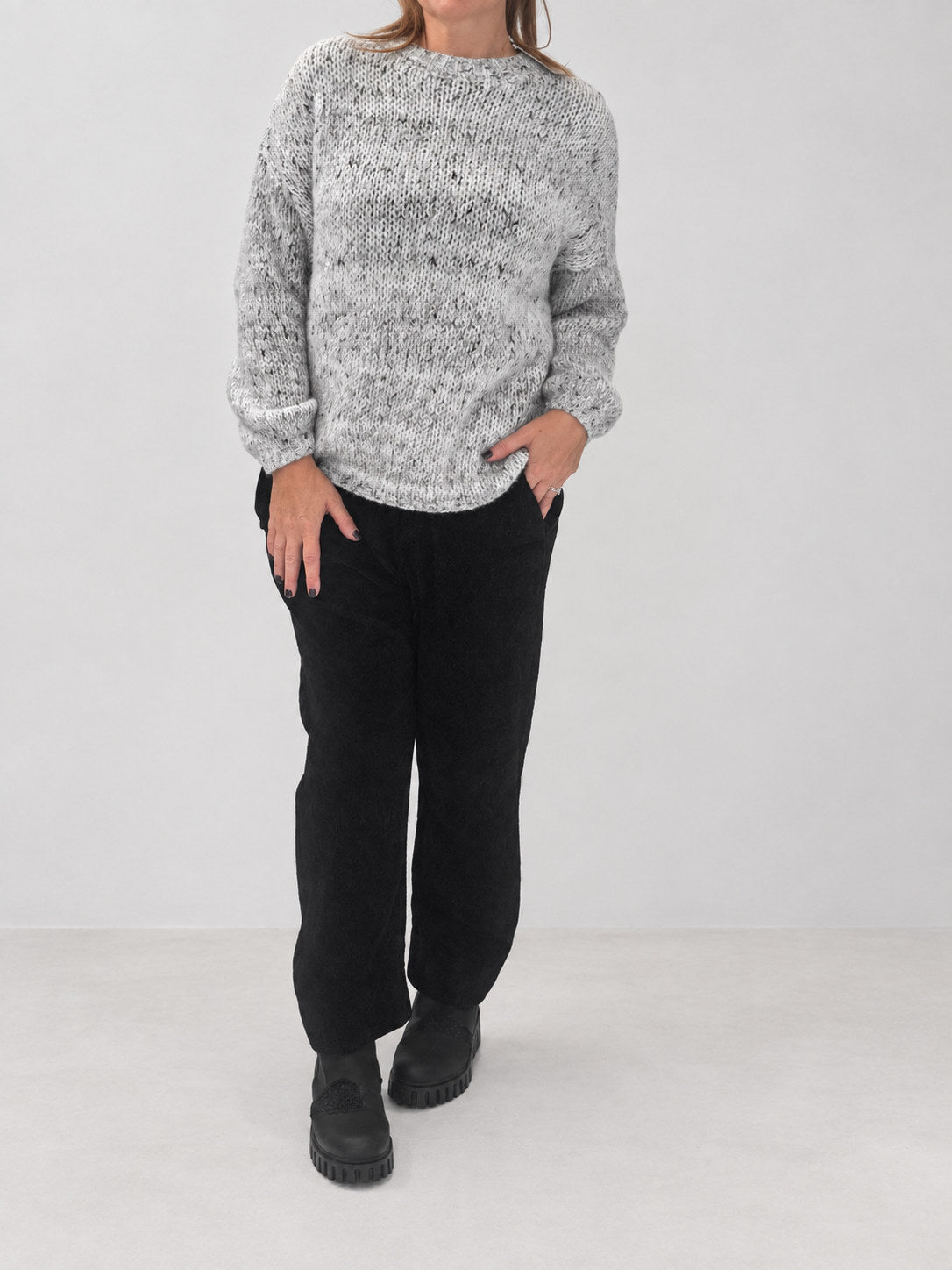Transit black pull-on trousers styled with a light grey jumper