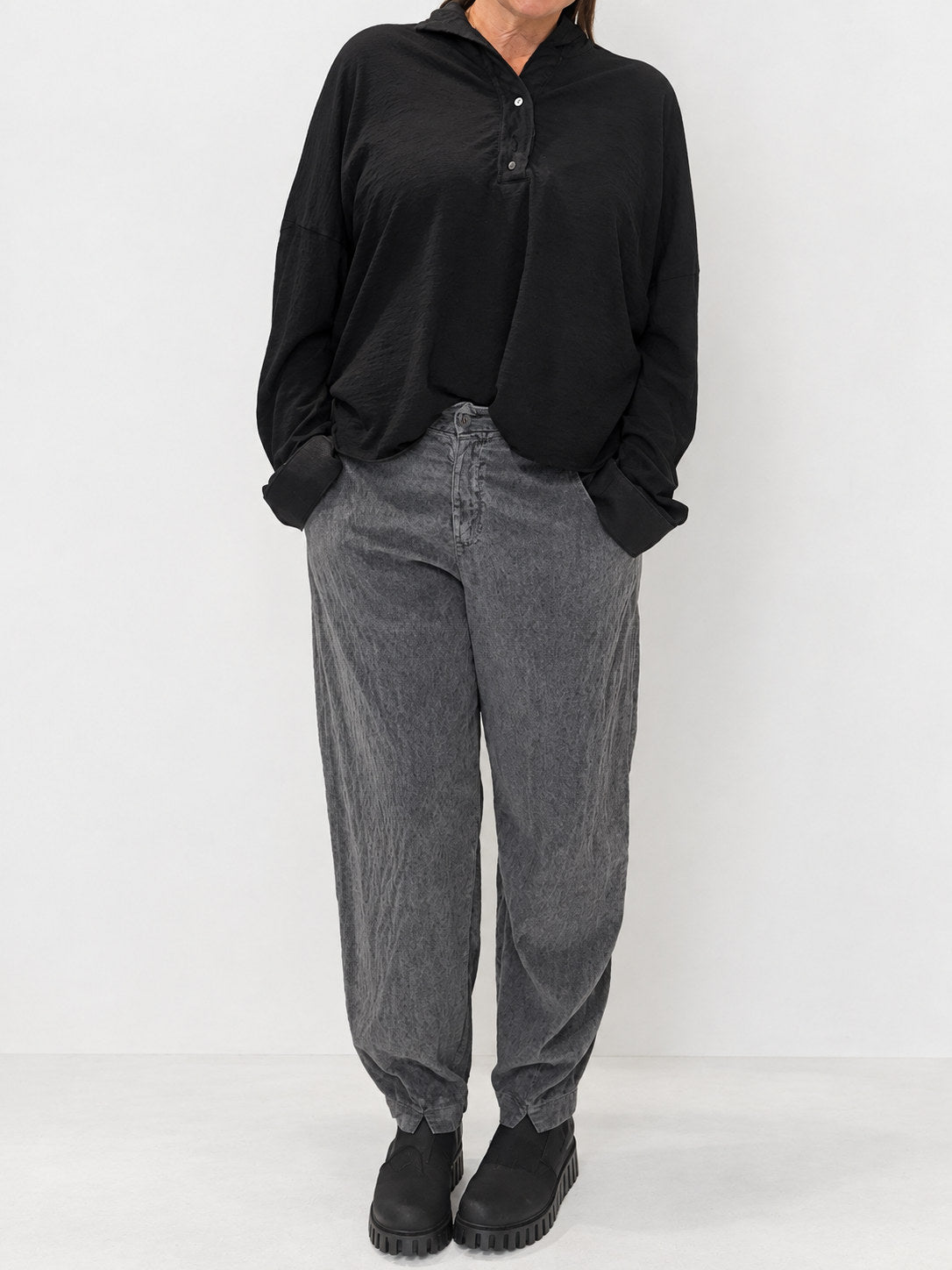 Transit grey textured tapered trousers styled with a black top