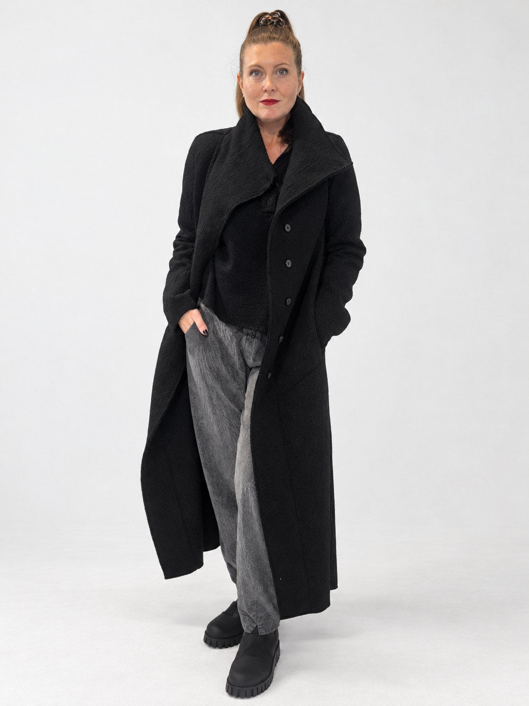 Transit black sculptural virgin-wool long coat – full-length front view