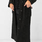 Transit black textured long coat – button placket and flap-pocket detail