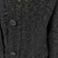 Transit black long coat – close-up of flecked texture and tonal buttons